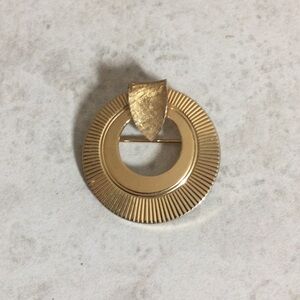 Gold Art Deco circle fan pin